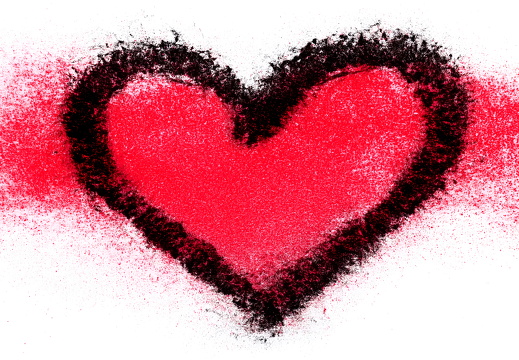 Red heart drawn with lipstick on white surface